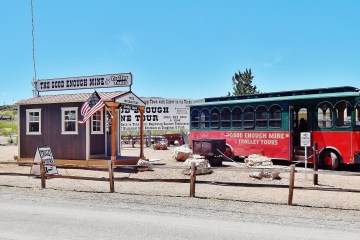 a truck is parked in front of a sign